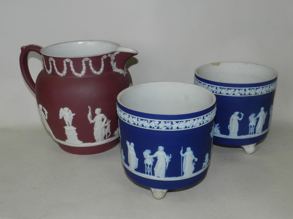 A pair of late 19th/early 20th century Wedgwood dark blue and white jasper ware jardinieres on