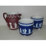 A pair of late 19th/early 20th century Wedgwood dark blue and white jasper ware jardinieres on