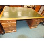 An early 20th century mahogany partners type pedestal desk,