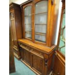 A reproduction mahogany coffee table together with an early 20th century oak cupboard and a