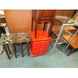 A red painted three drawer bedside cabinet, a 1920s pot cupboard,