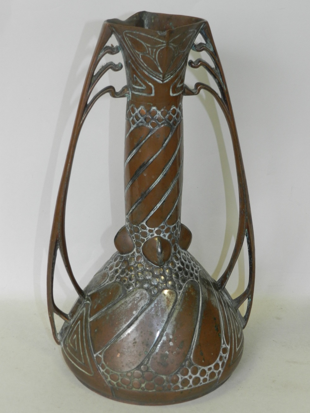 A Carl Deffner Art Nouveau tinned copper vase of bellied form with twin scroll handles,