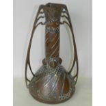 A Carl Deffner Art Nouveau tinned copper vase of bellied form with twin scroll handles,