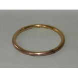 A 9ct gold plain polished hinged bangle.