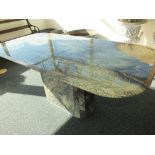 A 20th century variegated marble pedestal centre table with rounded corners to the rectangular top