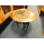 An Islamic brass and wood occasional table,