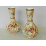 A pair of Royal Worcester blush ivory vases decorated with flowers,
