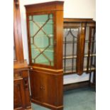 A 20th century reproduction mahogany glazed standing corner cabinet.