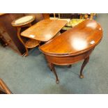 A 19th century mahogany fold-over demi-lune occasional table together with a mahogany tripod tilt