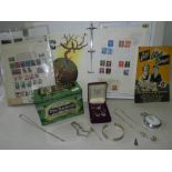 A collection of white metal jewellery, a stop watch, a stamp album and loose stamps, etc.