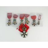 An assorted collection of seven French legion of honour badges, silver and polychrome enamel,