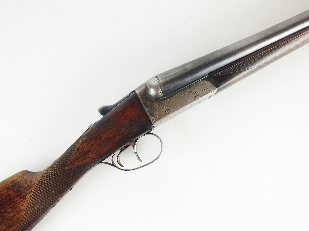 A 12 bore ejector double barrelled side by side shotgun by AYA boxlock,