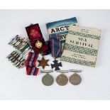 A pair of World War II medals, Defence and War medal, in air ministry cardboard box addressed to 'J.