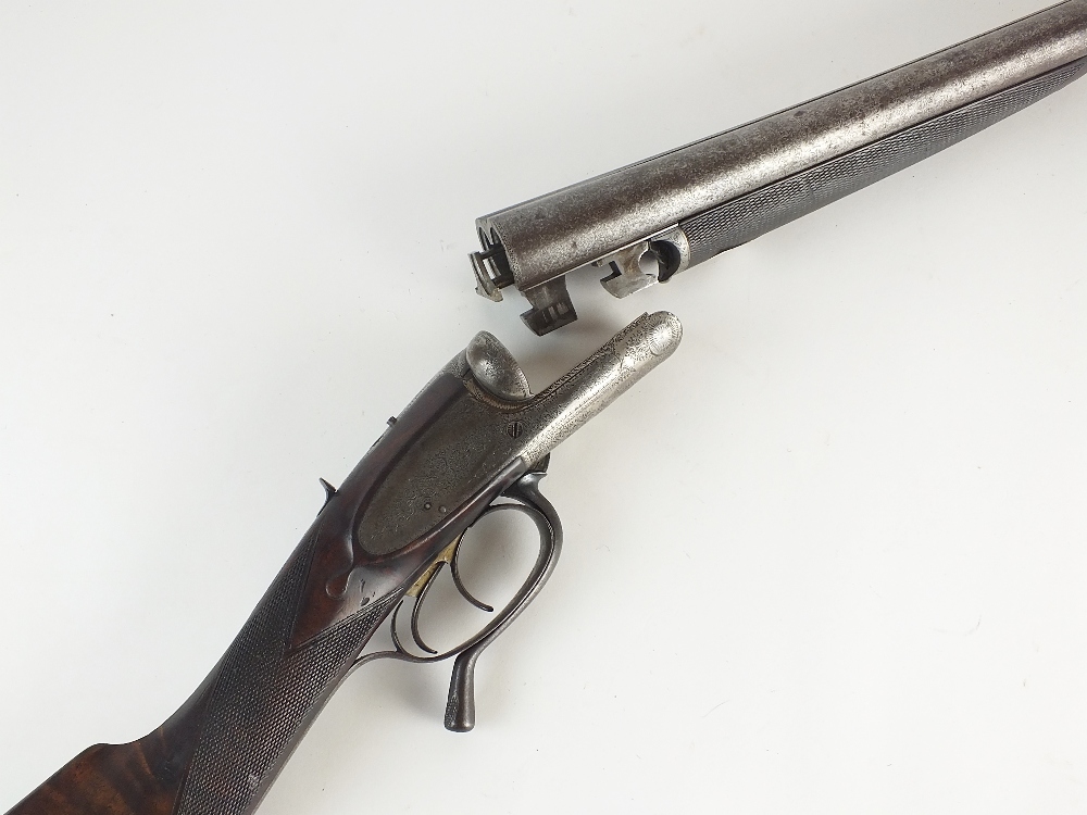 A 12 bore non ejector double barrelled side by side shotgun marked H Robinson, Damascus barrels,