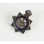 A King's crown white metal and blue enamel Cheshire constabulary badge, stamped 'Sterling Silver',