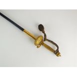 A George V court sword, gilt faceted serrated grip, quillons and shell guard,