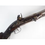 A Turkish flintlock blunderbuss, early 19th century with flared muzzle and traces of foliate work,