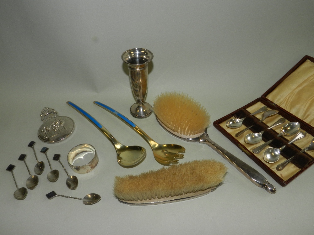 A pair of silver gilt and blue enamel salad servers together with silver backed dressing table