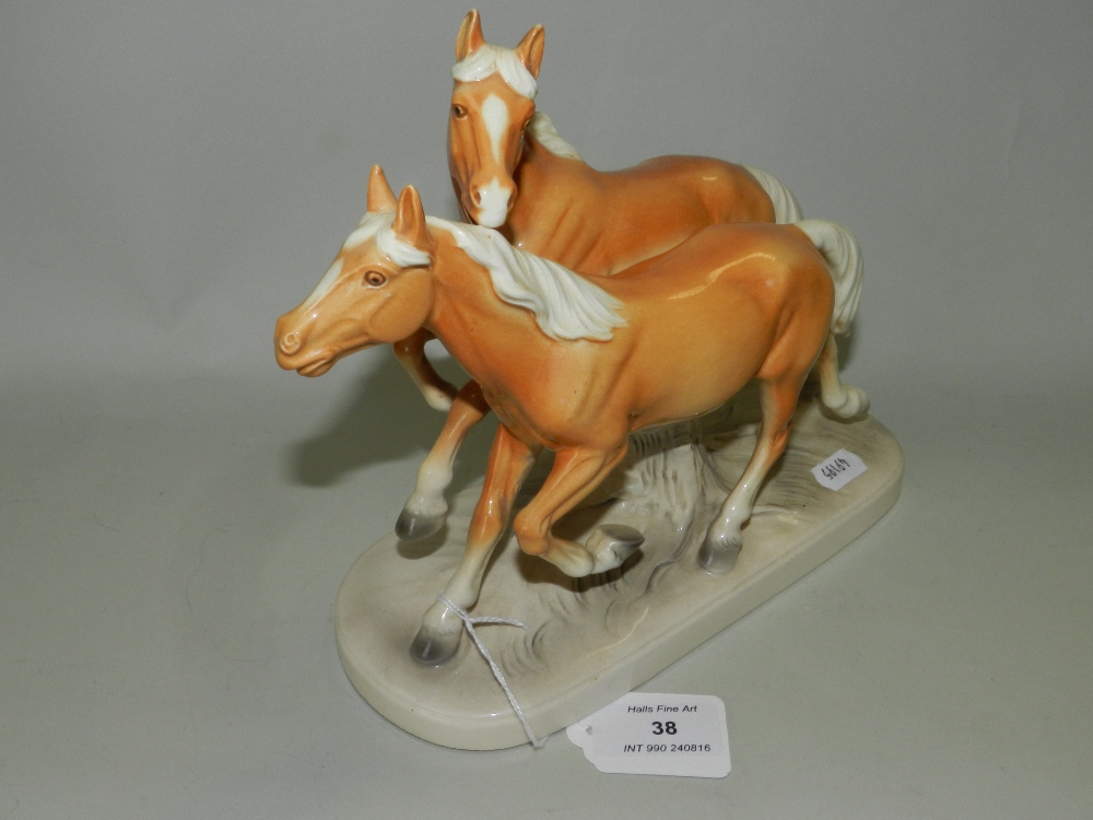 A German pottery equestrian figure group,