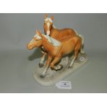 A German pottery equestrian figure group,