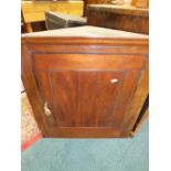 A 19th century mahogany straight front corner cupboard containing two shelves