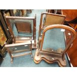 Four various George III and Victorian swing toilet mirrors, the Victorian example with arched plate.