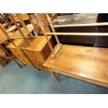 A beech framed valet stand and a pair of oak bedside chests of four drawers,