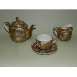 A Japanese Kutani eggshell porcelain tea set together with a 19th century English earthenware pink