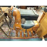 A modern Pakistan hardwood rocking horse bearing label 'Victoria Furniture House, University Road,