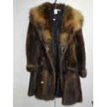 A musquash fur coat with cross fox collar,