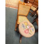 A beech framed cane seat and back rocking chair and a tapestry top piano stool
