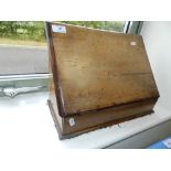 An Edwardian walnut fall front stationery box with tooled leather skiver