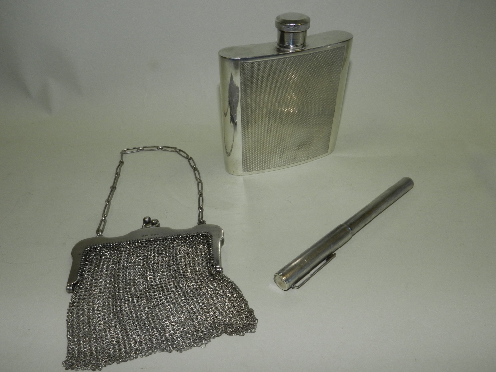 A Continental silver mesh purse together with a white metal pen and a chromium plated hip flask