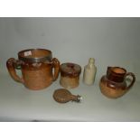 A quantity of salt glazed stoneware jugs, mugs and bottles of typical form,