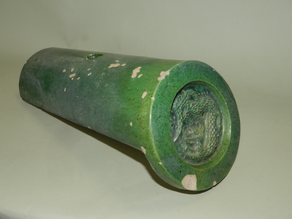A Chinese Sancai glazed roof tile of semi cylindrical form,
