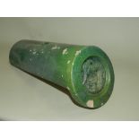 A Chinese Sancai glazed roof tile of semi cylindrical form,