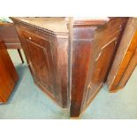 A George III oak straight front corner cabinet with fielded panel door and another George III oak