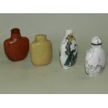 Four Chinese snuff bottles including a pale green hardstone, an aventurine glass,