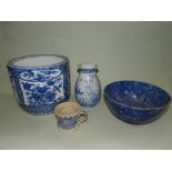 A quantity of blue and white pottery and porcelain to include a British earthenware water jug and