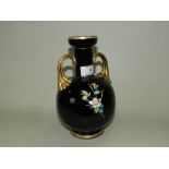 A French opalescent black glass vase decorated in enamel colours with a bird in flowering branch