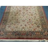 A large modern Persian cream ground carpet,