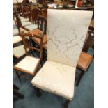 A Charles II style oak framed panel back and seat dining chair,
