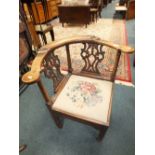 A George III mahogany framed corner desk chair with double splat back.