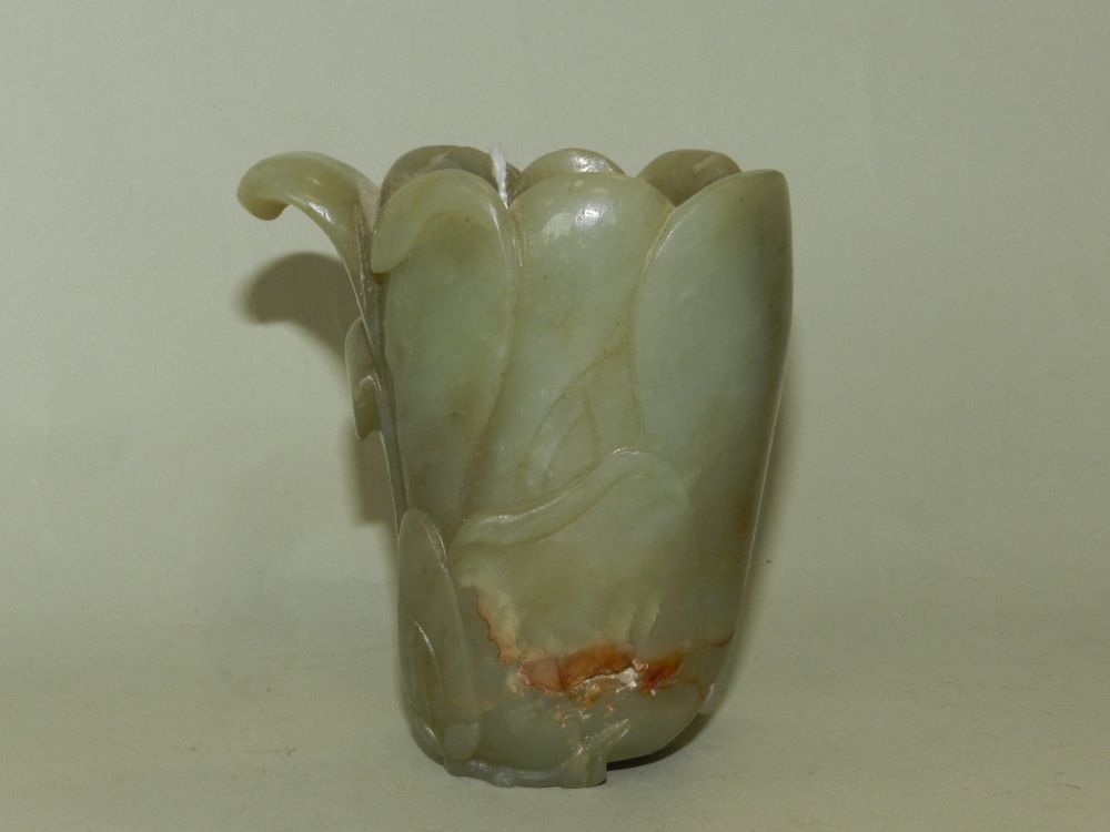 A Chinese carved jade brush washer in the form of a closed lotus flower