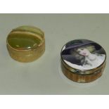 An enamel pill box the cover decorated with a portrait of a lady with guilloche enamel sides,