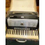 A Parma cased accordion with forty one note keyboard and various musical instrument buttons