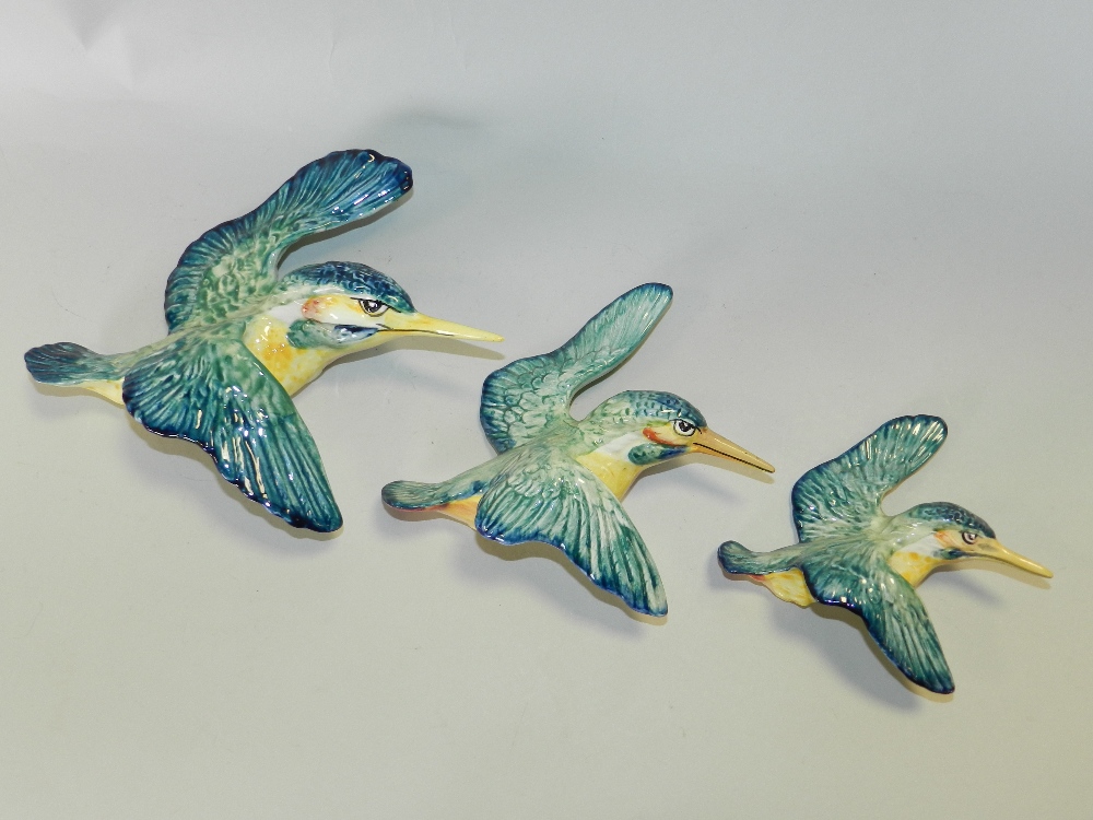 A graduated set of three Beswick kingfisher wall plaques