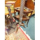 A 19th century mahogany torchere stand and two others,