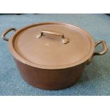 A large French copper pan and cover, stamped with Paris makers marks,