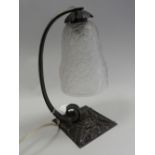 A French Art Deco moulded glass table lamp with metal branch and stand